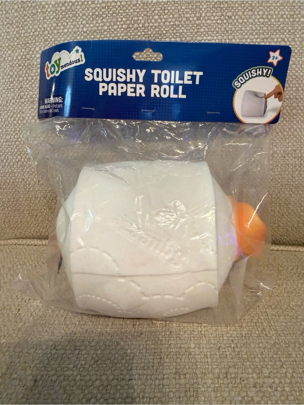 Squishy Toilet Paper Roll Stress Toy - White with Orange Core